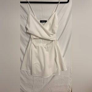 Beautiful white Akira dress. Size small, medium stretch
